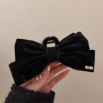 Black Plush Crab Pin With Bow - Image 2